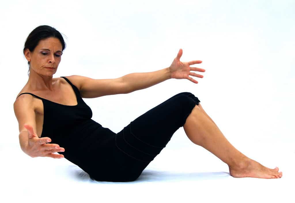 Half roll back with obliques Opale Pilates Ibiza