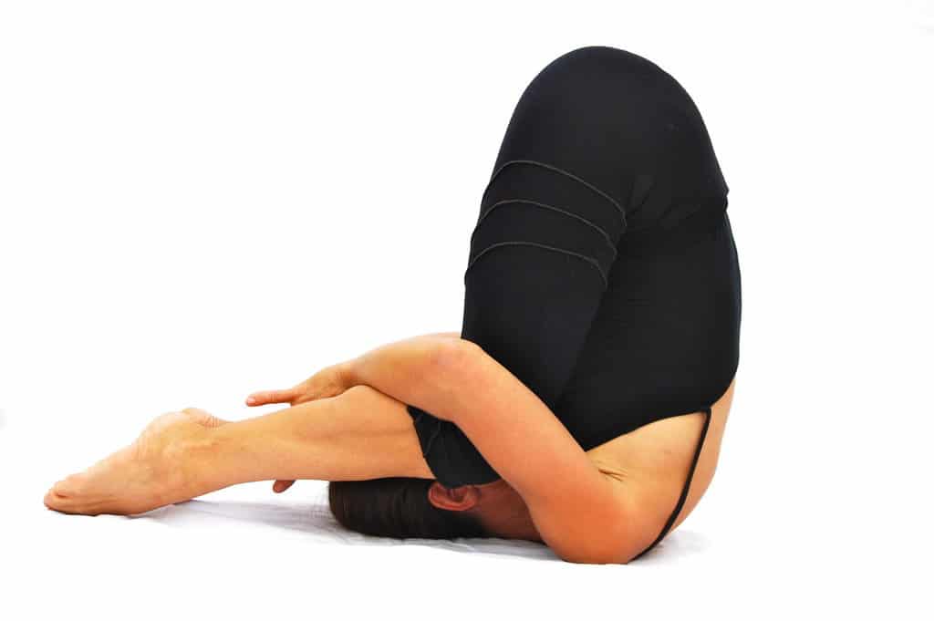 Karnapidanasana ear pressure pose Opale Yoga Ibiza