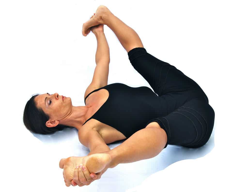 Supta prasarita padottanasana reclined wide leg stretched out pose Opale Yoga Ibiza