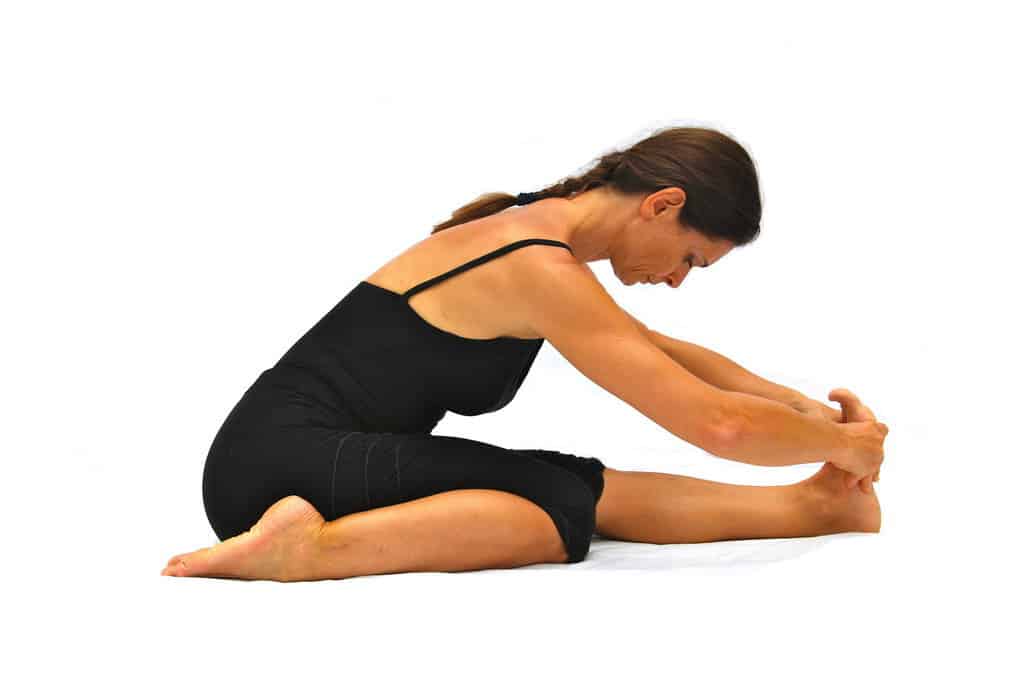Tryanga mukaikapada pascimottanasana 3 limbs touching face to 1 leg back stretched out pose Opale Yoga Ibiza